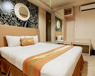 Hotel Grand Rosela - Yogyakarta - Bedroom