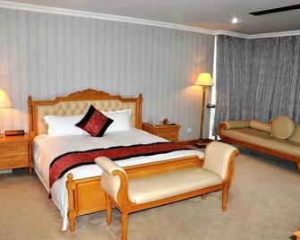 Xin'an Yihao Hotel - Near Xiamen Railway Station, near Vientiane City, minibar is free - Xiamen - Bedroom