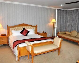 Xin'an Yihao Hotel - Near Xiamen Railway Station, near Vientiane City, minibar is free - שיאמן - חדר שינה