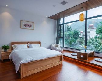 Bai Shi Yun Jv Homestay - Xi'an - Sypialnia