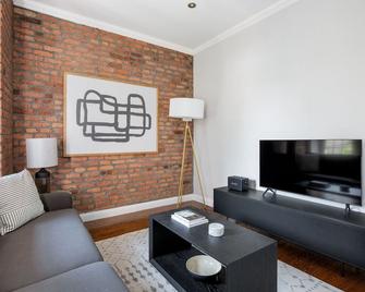 Lovely Nolita 2BR w/ Balcony & W/D, nr Museum & Groceries, by Blueground - New York - Living room