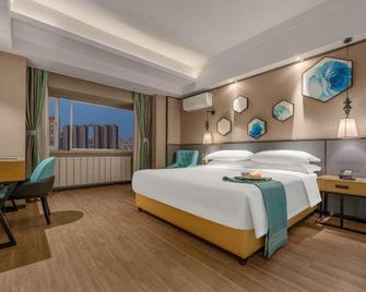 Xana Lite Hotelle (Baotou Qingshan Wanda Plaza) - Baotou - Bedroom
