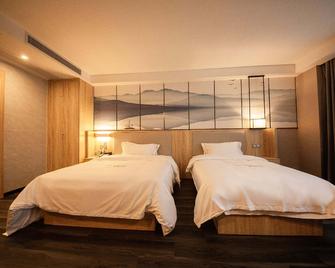 Qingmu Select Hotel (Hanshan Taihushan South Road) - Ma'anshan - Bedroom