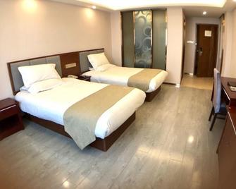 Greentree Alliance Jiangsu Yangzhou Hanjiang Middle Road Libao Square Hotel - Jang-čou - Ložnice