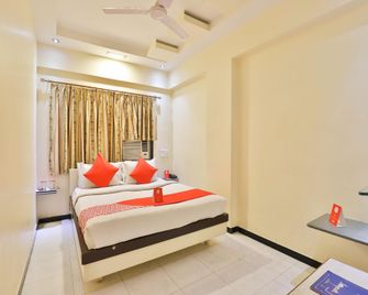 Hotel O Nova Hotel Nildeep - Rajkot - Bedroom