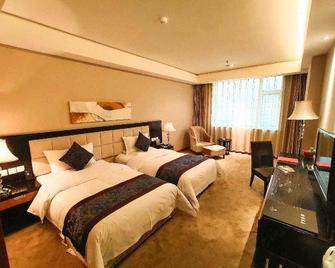 Oriental Lily Hotel - Lüliang - Bedroom
