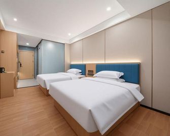 Xinyujiang Airport Hotel (Urumqi Tianshan International Airport) - Ürümqi - Bedroom