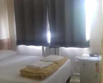 City Hotel - Ibiraçu - Camera da letto