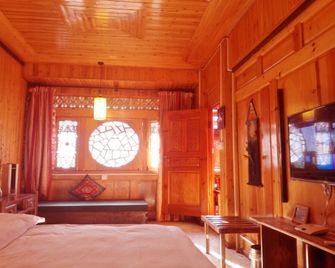 Lijiang Xianyun Xiaozhu Inn - ליז'יאנג - חדר שינה