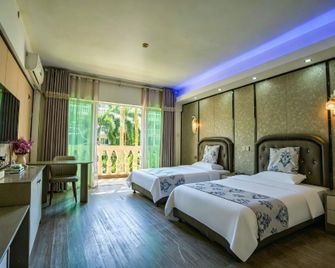 Oriental Garden Hot Spring Hotel (Xinglong Tropical Botanical Garden Branch) - Wanning - Bedroom