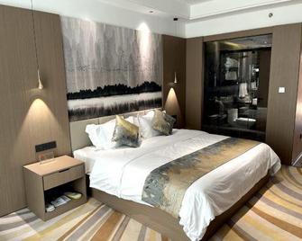 Jiayuguan International Hotel - Jiayuguan - Schlafzimmer