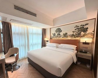 Vienna Hotel Kaili Stadium - Qiandongnan - Bedroom