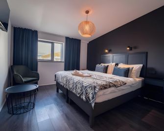 Farmhouse Lodge - Vik - Schlafzimmer