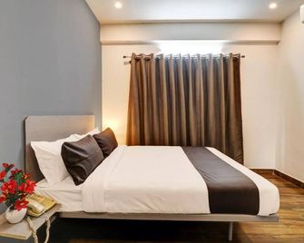 Super Townhouse Ecity Inn - Bangalore - Slaapkamer