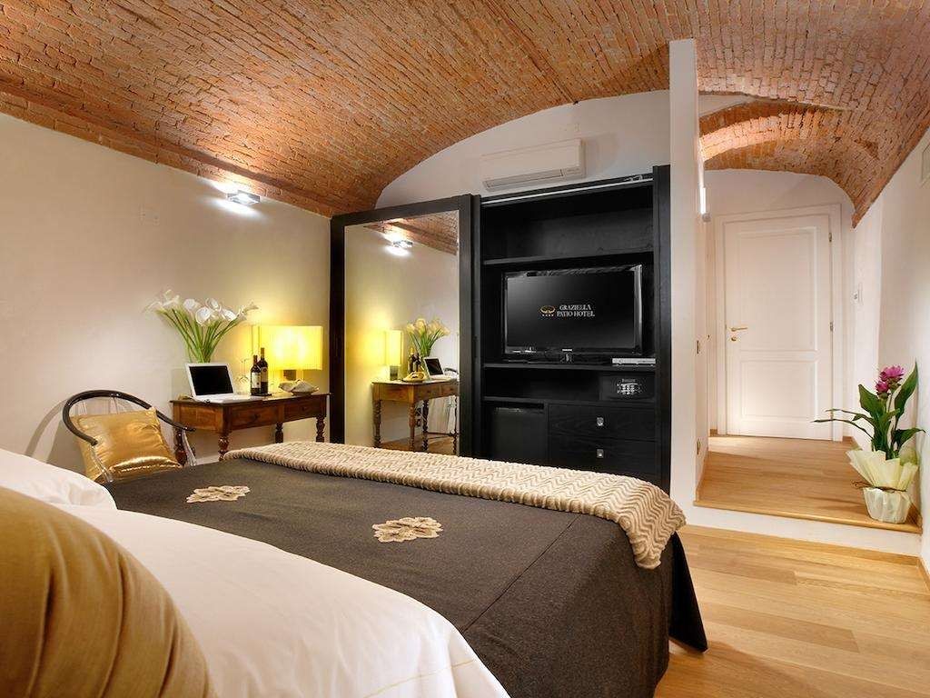 Graziella Patio Hotel - ארצו - חדר שינה