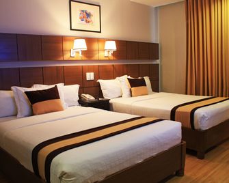 The Pinnacle Hotel and Suites - דבאו - חדר שינה