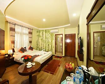 Hotel Osho Home - קטמאנדו - חדר שינה