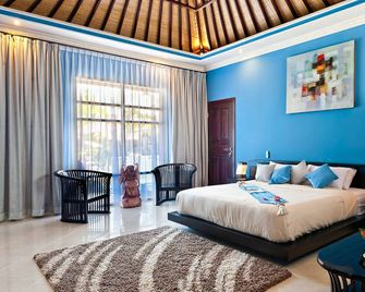 Rossa Garden Hotel Boutique - Manggis - Bedroom