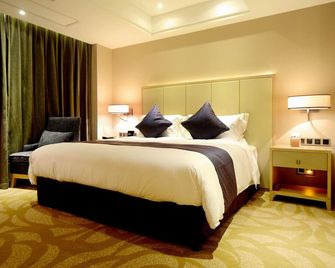 Sky World Hotel Qingdao - Qingdao - Habitación