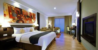 Aston Pontianak Hotel And Convention Center - Pontianak - Bedroom