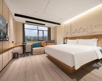 Madison Hotel Anqing Huifeng Wuyue Plaza - Anqing - Slaapkamer