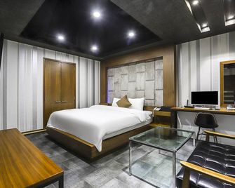 هوتل تي جاي - سيول - غرفة نوم