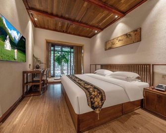 Taoshe Resort Hotel (People's Square Taoyangli Scenic Area Branch) - Jingdezhen - Schlafzimmer