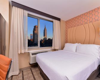 فندق هوليداي إن نيويورك - تايمز سكوير - نيويورك - غرفة نوم