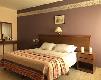 Sufara Hotel Suites - Amman - Slaapkamer