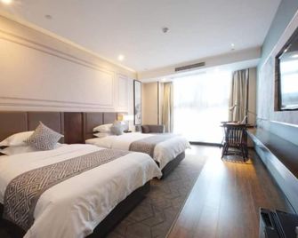 Gem Hotel Hefei Feidong County High Speed Railway Station Longquan East Road Hotel - Hefei - Schlafzimmer