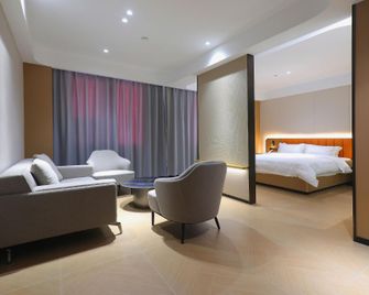 Zhixin Gardenia Hotel (Changjiang University Jingzhou Vocational College) - Jingzhou - Living room