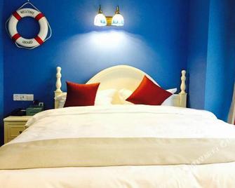 Haiyun Youth Travel Hotel (Leshan Giant Buddha Zhanggongqiao Food Street Branch) - Leshan - Habitación