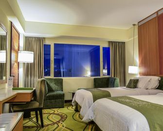 Grand Allison Hotel - Jayapura - Schlafzimmer