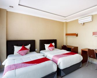 Collection O 3431 Hotel Alpha Bandara - Palembang - Schlafzimmer