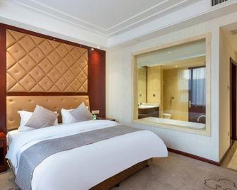 Regan International Hotel - Wuxi - Slaapkamer