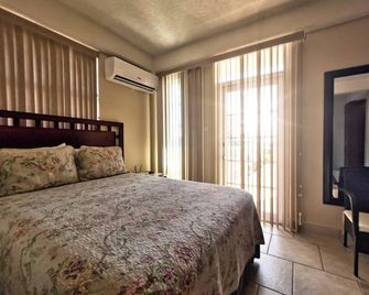 Timbos Suites - רוזו - חדר שינה