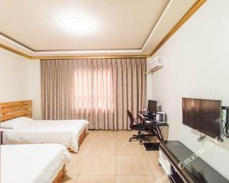 Jingdong Business Hotel - Deyang - Спальня