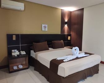 Tripletree Dgria Hotel - Serang City - Спальня