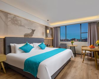 Fei Li International Hotel 翡丽国际酒店(广州石井地铁站白云火车站店) - Kanton - Sypialnia