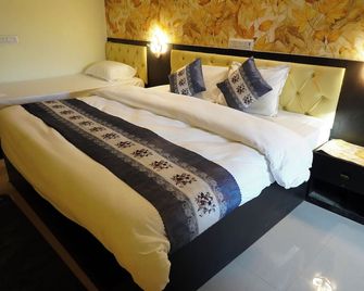 Hotel The Sangha Residency - Варанасі - Спальня