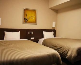 Hotel Route-Inn Sapporo Chuo - Sapporo - Yatak Odası