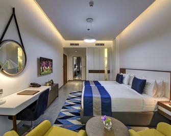 Abar Hotel Apartments Dip-1 - Dubai - Yatak Odası
