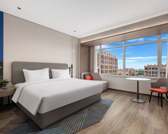 Holiday Inn Express Qingdao Hongdao Station By IHG - צ'ינגדאו - חדר שינה