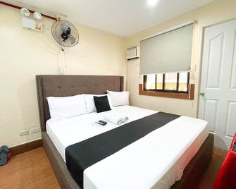 Chanel Paris Hotel powered by Cocotel - Taguig - Ložnice