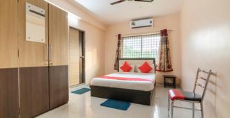 OYO Flagship Surya Residency - Bengaluru - Bedroom