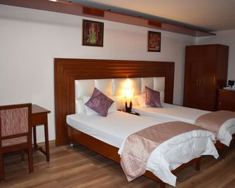 Hotel Sujata - Bodh Gaya - חדר שינה