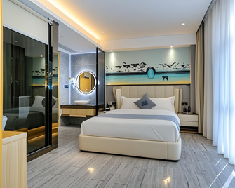 Lan Hang Jing Pin Jiu Dian (Shen Zhen Bao An Guo Ji Ji Chang Gu Shu Di Tie Zhan Dian ) - Shenzhen - Bedroom