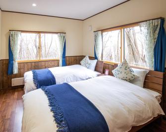 Kudo's Lodge - Otari - Slaapkamer