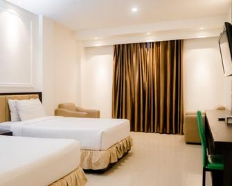 D'Blitz Hotel Kendari - Кендарі - Спальня
