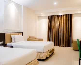 D'Blitz Hotel Kendari - Kendari - Schlafzimmer